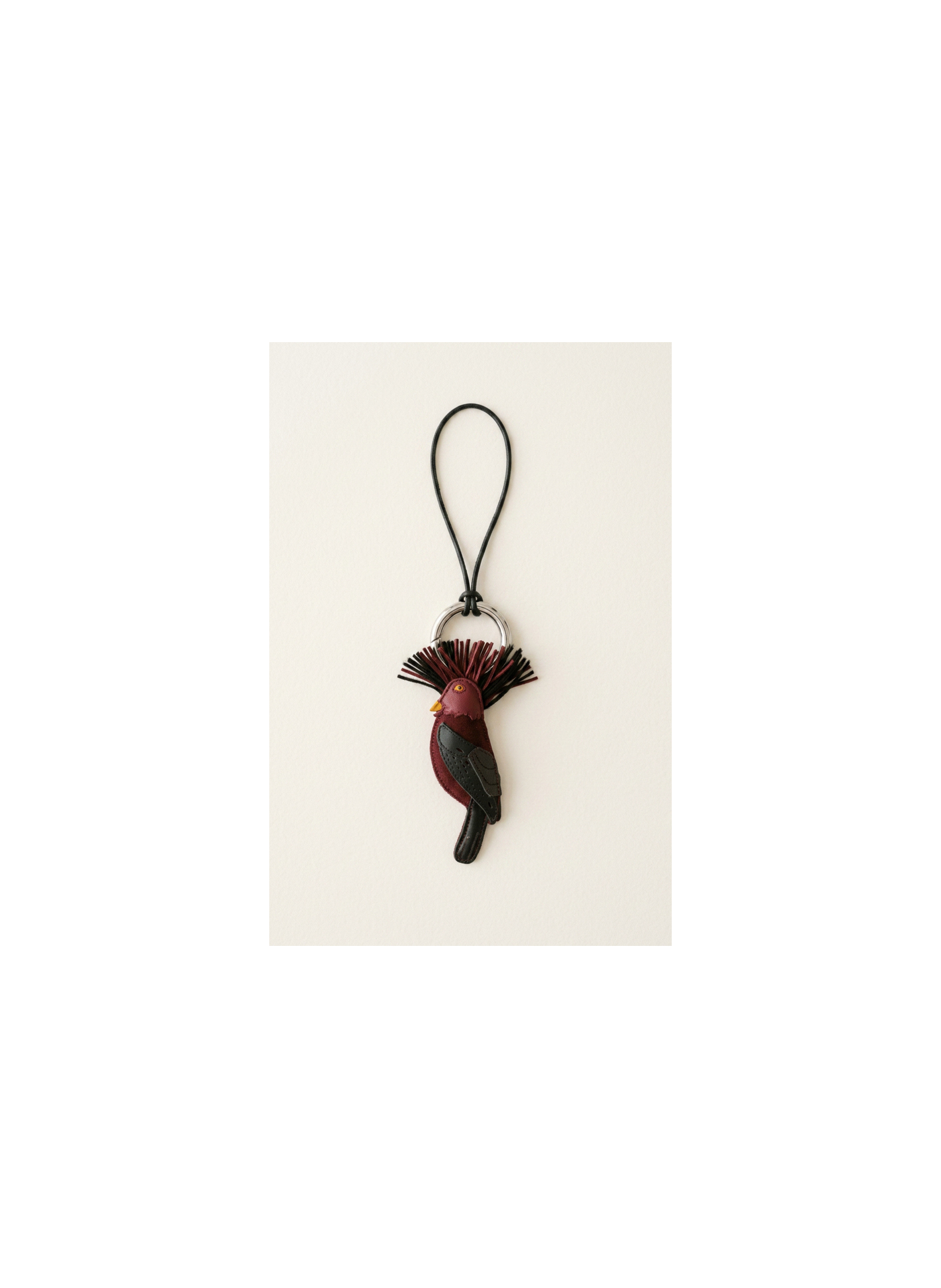 Porte clé oiseau coq-de-roche en cuir agneau et lien en cuir